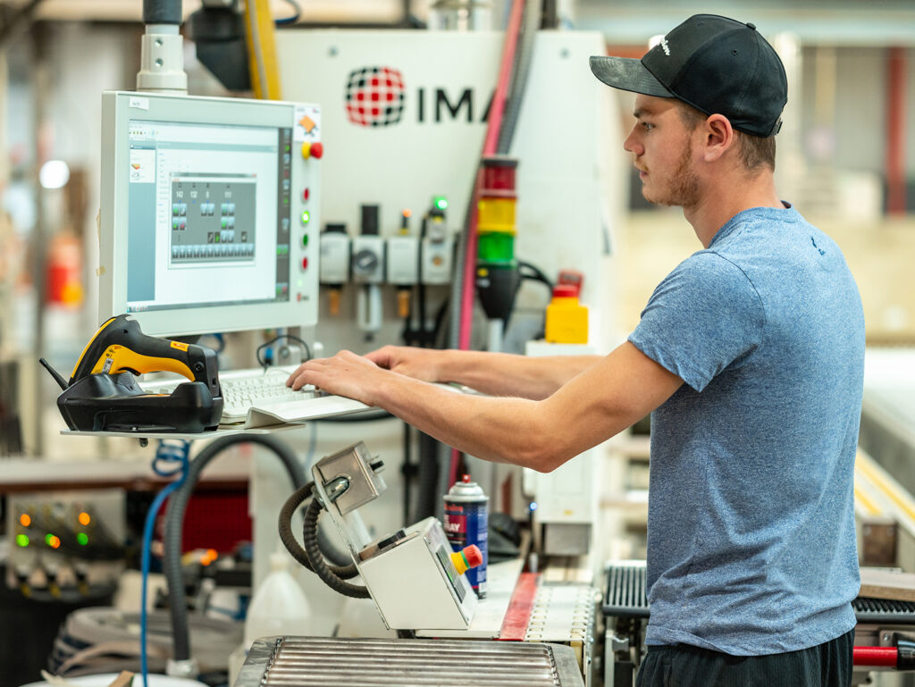 Technician assembling precision parts at NAC - Your career at NAC