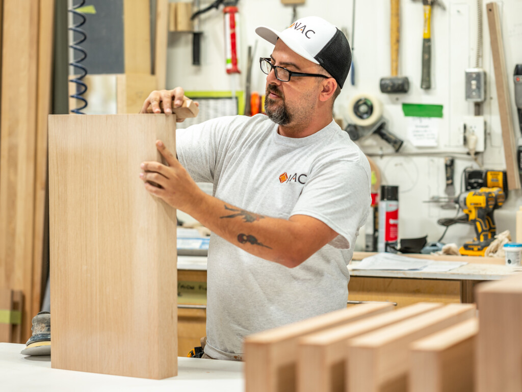 Craftsman designing custom cabinets at NAC - Your career at NAC